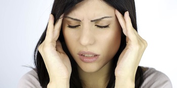 Woman Rubbing Temples