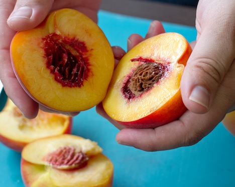 Two Peaches held in hand